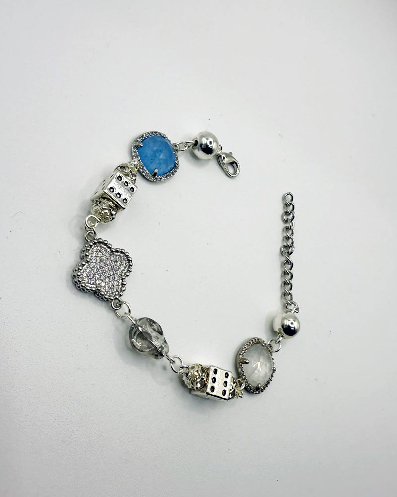Sliver plated clover bracelet with blue gemstone accent and silver charms for streetwear style | Sodr3am Jewelry.